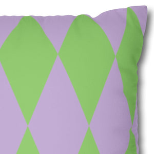 Decorative pillow with green diamond pattern on a purple background