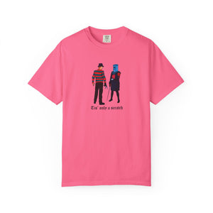 Pink t-shirt with graphic design of two characters and text on a white background
