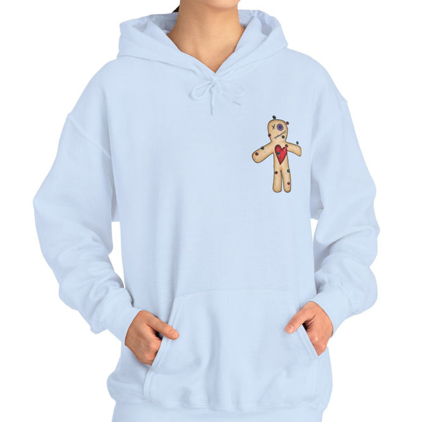 Light blue hoodie with voodoo doll design worn by a person on a white background