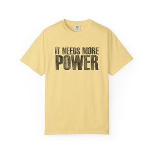 Yellow t-shirt with 'IT NEEDS MORE POWER' text on a white background