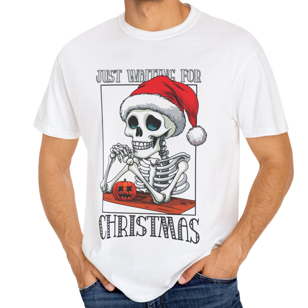 Funny Halloween t-shirt Man wearing a white t-shirt with a skeleton wearing a Santa hat graphic and text.