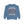 A dusty blue crewneck sweatshirt featuring a Halloween graphic of a dancing skeleton surrounded by falling autumn leaves, with the text 'IT'S THE MOST WONDERFUL TIME OF THE YEAR'.