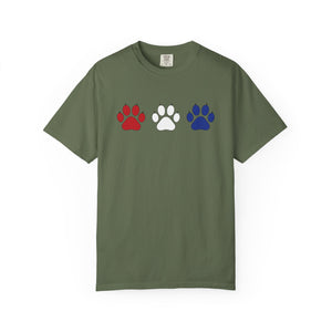 Green t-shirt with red, white, and blue paw prints on a white background