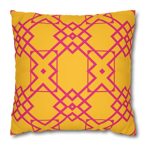 A square-shaped throw pillow with a yellow background and pink geometric patterns.