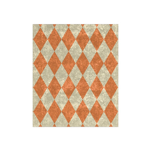 throw blanket with orange and beige diamond pattern on a white background