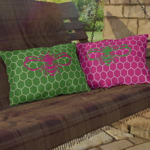 throw pillow with 'Honeycomb Bee Reversible Pink & Green' design