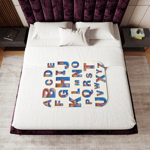 soft sherpa blanket with 'ABC Colorful Cutouts' design