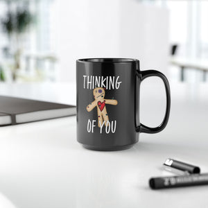 mug with 'Thinking of You Voodoo Doll Funny' graphic on a white background