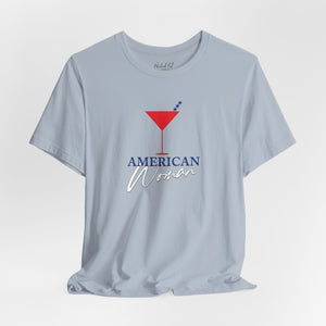 Baby blue t-shirt with 'American Woman Patriotic Martini July 4th' design on a white background