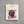 Folded t-shirt with a graphic of a person riding a unicorn and text 'Follow Your Dreams' on a concrete surface.