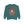 Teal sweatshirt with a festive design featuring a woman in a Santa hat and text on a white background