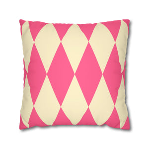 Pink and beige diamond patterned pillow on a white background