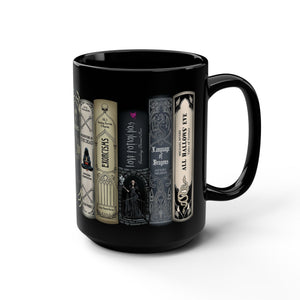 A black ceramic mug featuring a printed graphic of five gothic book spines with gothic-themed quotes, shown on a clean white background.