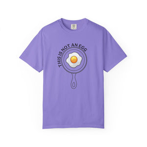 Purple t-shirt with an egg design and text on a white background