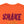 Close-up of an orange t-shirt featuring a distressed dark magenta graphic that reads 'SHAKE' partially visible below in orange.