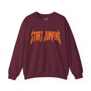 A maroon crewneck sweatshirt featuring the words 'START JUMPING' printed across the chest in a stylized orange font, displayed on a clean white background.