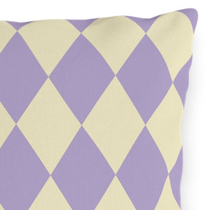 Decorative pillow with purple and beige diamond pattern on a white background