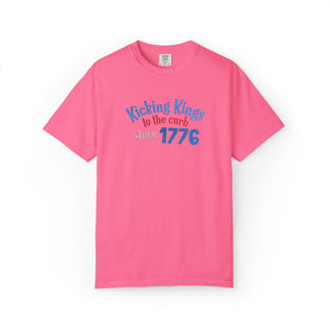 Pink t-shirt with text 'Kicking Kings to the curb since 1776' on a white background