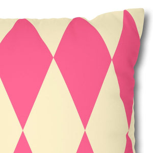 Decorative pillow with pink and beige geometric pattern on a white background
