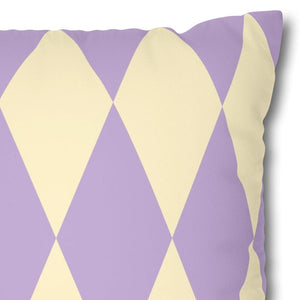 Decorative pillow with purple and yellow diamond pattern on a white background