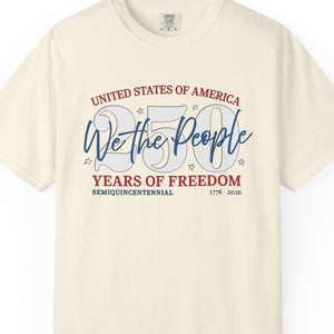 Beige t-shirt with 'We the People' and '250 Years of Freedom' text on a white background