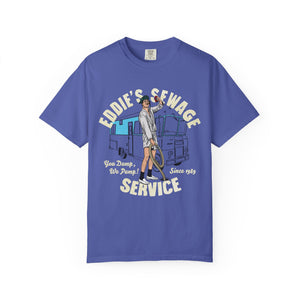 Blue t-shirt with logo graphic and text 'Eddie's Sewage Service You Dump We Pump Since 1989'.