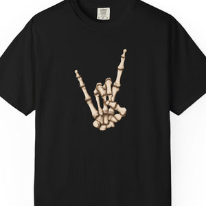 A black short-sleeve crewneck t-shirt featuring a graphic of a skeletal hand making the rock on paper gesture on the chest, displayed against a solid white background.