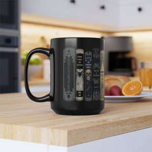 Black coffee mug with Halloween books design.