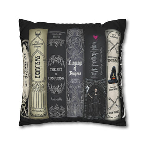 A square black throw pillow featuring a gothic-themed book cover design with five illustrated books and text including 'Exorcisms', 'The Art of Conjuring', 'Language of Dragons', 'Love Potion No. 9', and 'The Book of the Dead'.