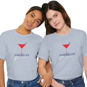 Light blue t-shirt with 'American Woman Patriotic Martini July 4th' design on a white background