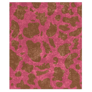 A decorative throw blanket with a pink and brown animal print pattern, displayed with a shiny finish on one side and a textured pink side on the other.