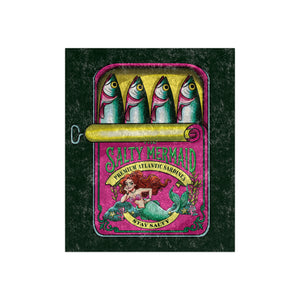 A square decorative blanket featuring a vintage-style mermaid illustration and the text 'SALTY MERMAID' and 'STAY SALTY.' The artwork shows four fish-like figures above a pink and teal illustrated panel, centered on a dark textured background.