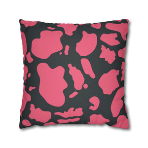 Pillow with pink and black abstract pattern on a white background