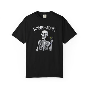 Black t-shirt with a graphic of a skeleton holding a martini with Bone-Jour in bone style lettering at the top.