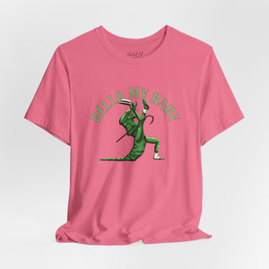 A pink short-sleeve crewneck t-shirt featuring a green alien dancing, with the text 'HELLO MY BABY' arched above it, displayed on a light gray background.