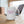 White mug with 'unapologetically difficult' text design on a wooden surface