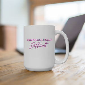 White mug with 'unapologetically difficult' text design on a wooden surface