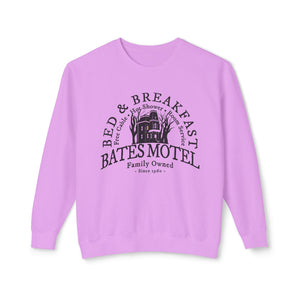 Neon violet sweatshirt with 'Bates Motel Halloween Fall' design on a plain background