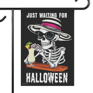 Yard flag with a skeleton wearing a hat and sunglasses drinking a pina colada and text that reads just waiting for summer