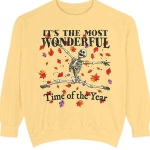 Yellow Halloween sweatshirt with skeleton design and text 'It's the most wonderful time of the year' on a white background