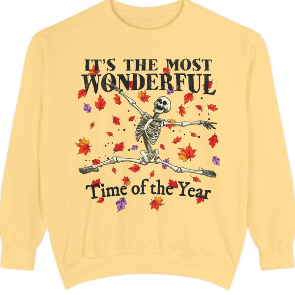 Yellow Halloween sweatshirt with skeleton design and text 'It's the most wonderful time of the year' on a white background