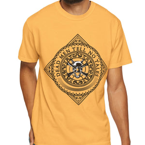 Man wearing a mustard yellow t-shirt with  text Dead Men Tell No Tales  and a black skull graphic design on a white background