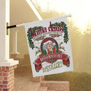 Decorative flag with Santa Claus and moonshine branding on a porch.