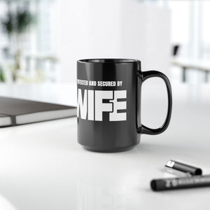 mug with 'Protected By Wife Funny Husband Gift' graphic on a white background