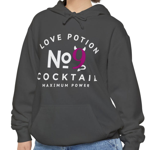 Person wearing a dark gray hoodie with text Love Potion No 9 Cocktail Maximum Power, on a white background