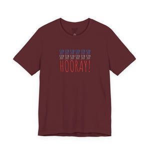 Black t-shirt with embroidered red white and blue text design on a white background