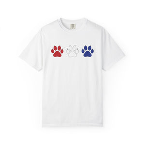 White t-shirt with red, white, and blue paw prints on a white background