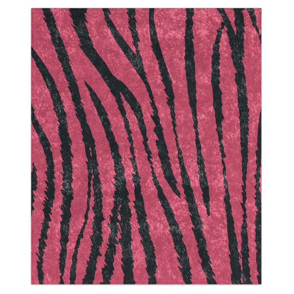 A decorative throw blanket with pink and dark grey striped animal print, featuring a shiny finish and hemmed edges.