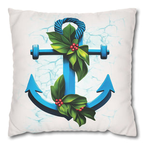 Decorative pillow with a blue anchor design featuring green leaves and red berries on a white background.