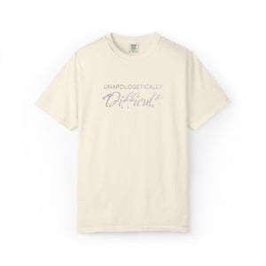 Beige t-shirt with 'Unapologetically Different' text on a white background